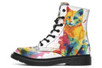 White boots, each with a different cat image, with watercolour splashes of colour coming out from behind them