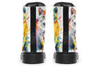 White boots, each with a different cat image, with watercolour splashes of colour coming out from behind them