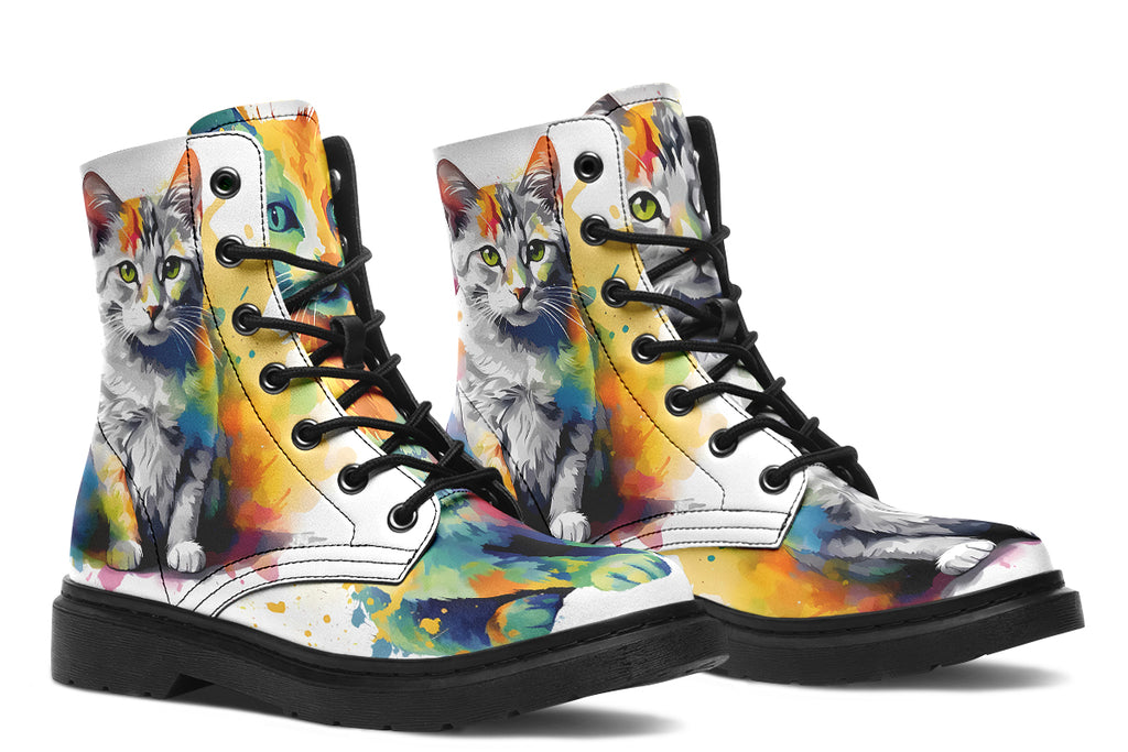 White boots, each with a different cat image, with watercolour splashes of colour coming out from behind them