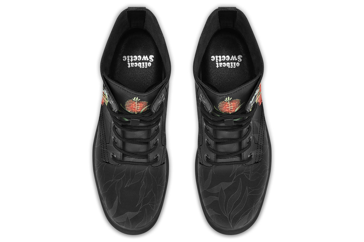 Black boots featuring an image of a king parrot with Australian flora