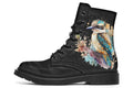 Boots featuring a subtle black leave patterned background, with a watercolour-style image of a kookaburra on the outsides of the boots, and purple and red wattle on the inside panels. 