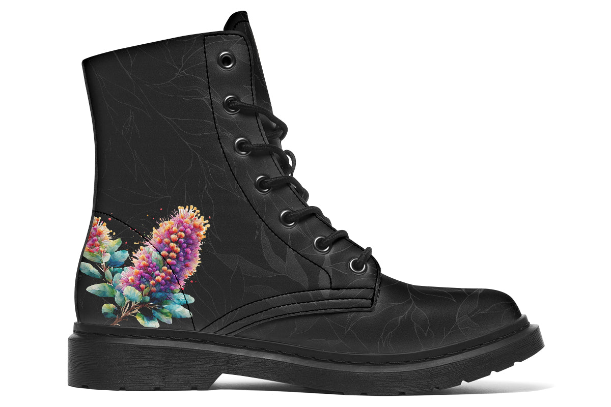 Boots featuring a subtle black leave patterned background, with a watercolour-style image of a kookaburra on the outsides of the boots, and purple and red wattle on the inside panels. 