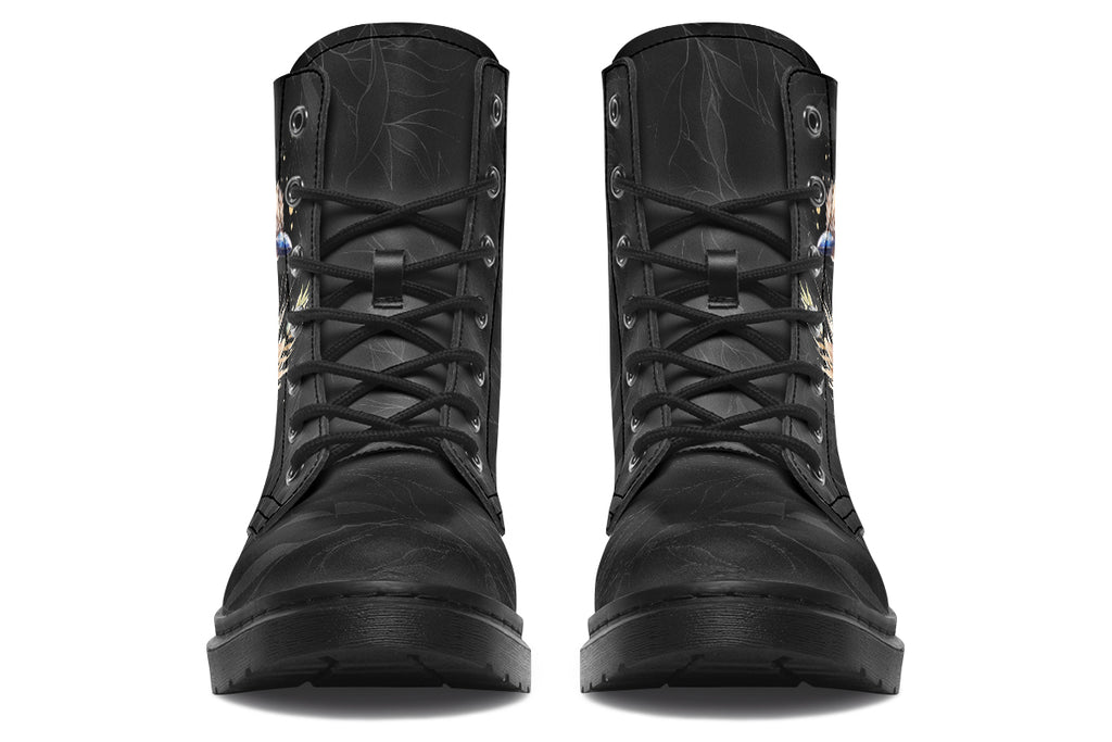 Boots featuring a subtle black leave patterned background, with a watercolour-style image of a kookaburra on the outsides of the boots, and purple and red wattle on the inside panels. 