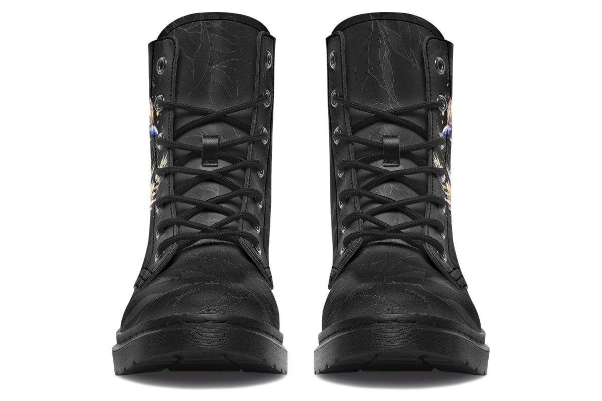 Boots featuring a subtle black leave patterned background, with a watercolour-style image of a kookaburra on the outsides of the boots, and purple and red wattle on the inside panels. 