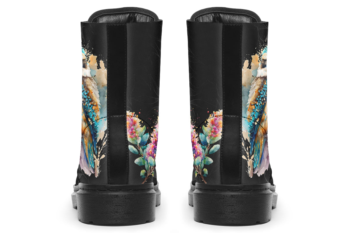 Boots featuring a subtle black leave patterned background, with a watercolour-style image of a kookaburra on the outsides of the boots, and purple and red wattle on the inside panels. 