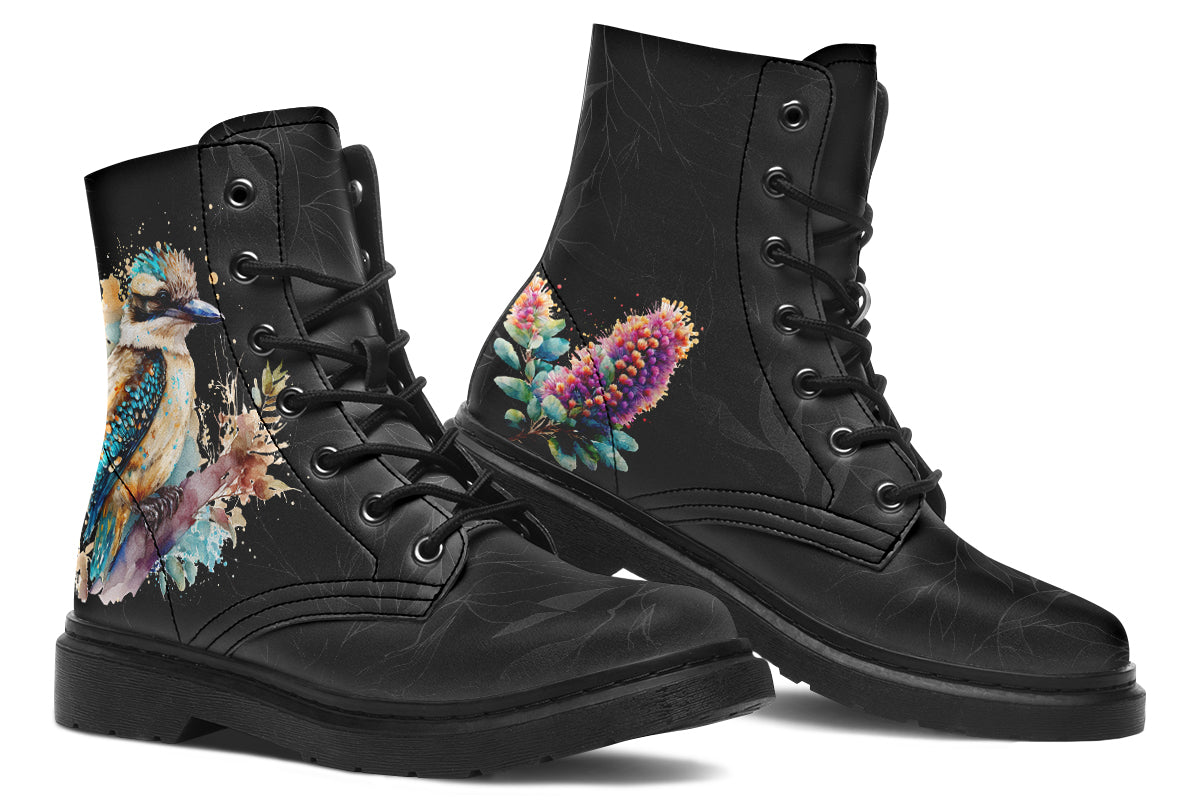Boots featuring a subtle black leave patterned background, with a watercolour-style image of a kookaburra on the outsides of the boots, and purple and red wattle on the inside panels. 