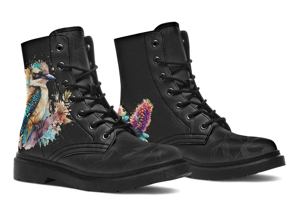 Boots featuring a subtle black leave patterned background, with a watercolour-style image of a kookaburra on the outsides of the boots, and purple and red wattle on the inside panels. 