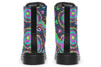 Indigenous Australian dot patterned design on boots with a black sole. The design has multiple colours, including pink, blue, green, purple, yellow and white, on a black background.