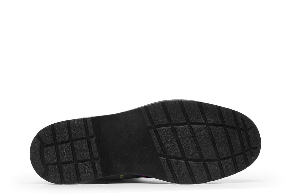 Indigenous Australian dot patterned design on boots with a black sole. The design has multiple colours, including pink, blue, green, purple, yellow and white, on a black background.