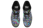 Indigenous Australian dot patterned design on boots with a black sole. The design has multiple colours, including pink, blue, green, purple, yellow and white, on a black background.