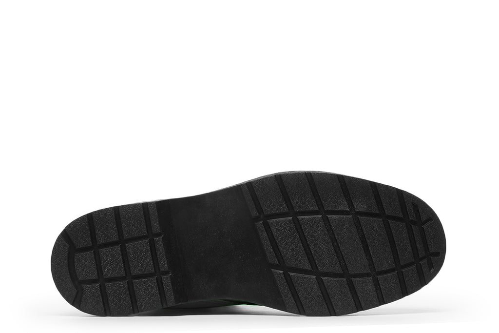 Vibrant green boots with a black sole.