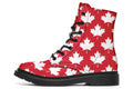 Red boots with white maple leaf patterns all over them