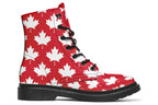 Red boots with white maple leaf patterns all over them
