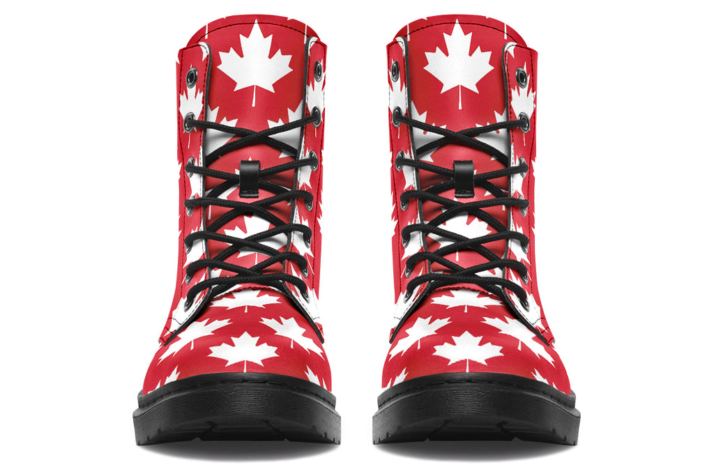Red boots with white maple leaf patterns all over them