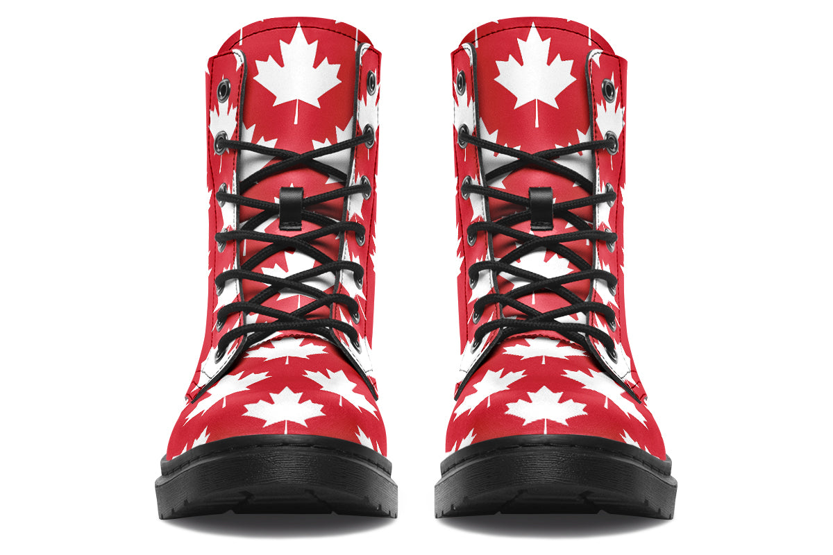 Red boots with white maple leaf patterns all over them