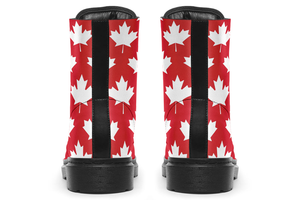 Red boots with white maple leaf patterns all over them