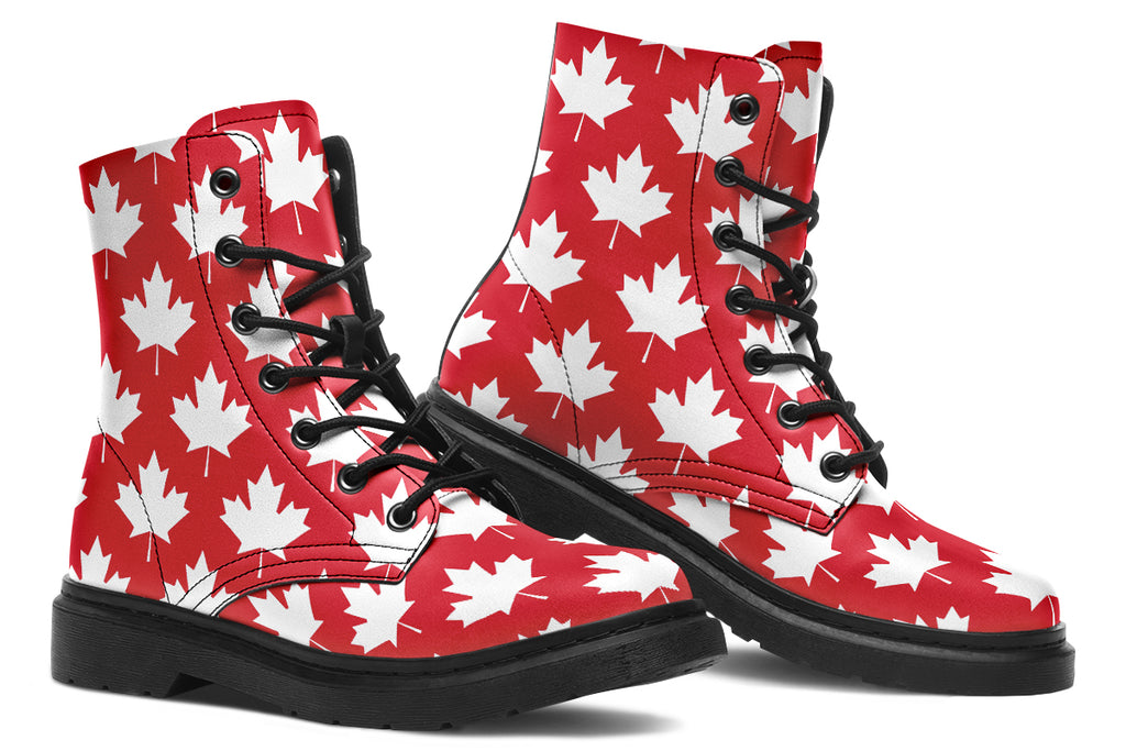 Red boots with white maple leaf patterns all over them