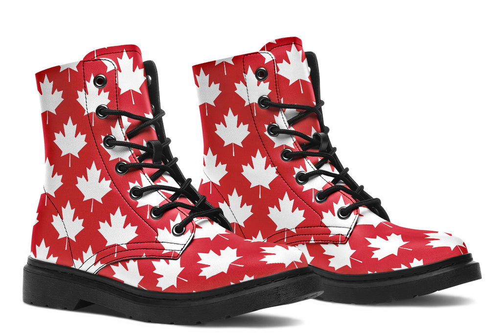 Red boots with white maple leaf patterns all over them