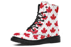 White boots with red maple leaf patterns all over it