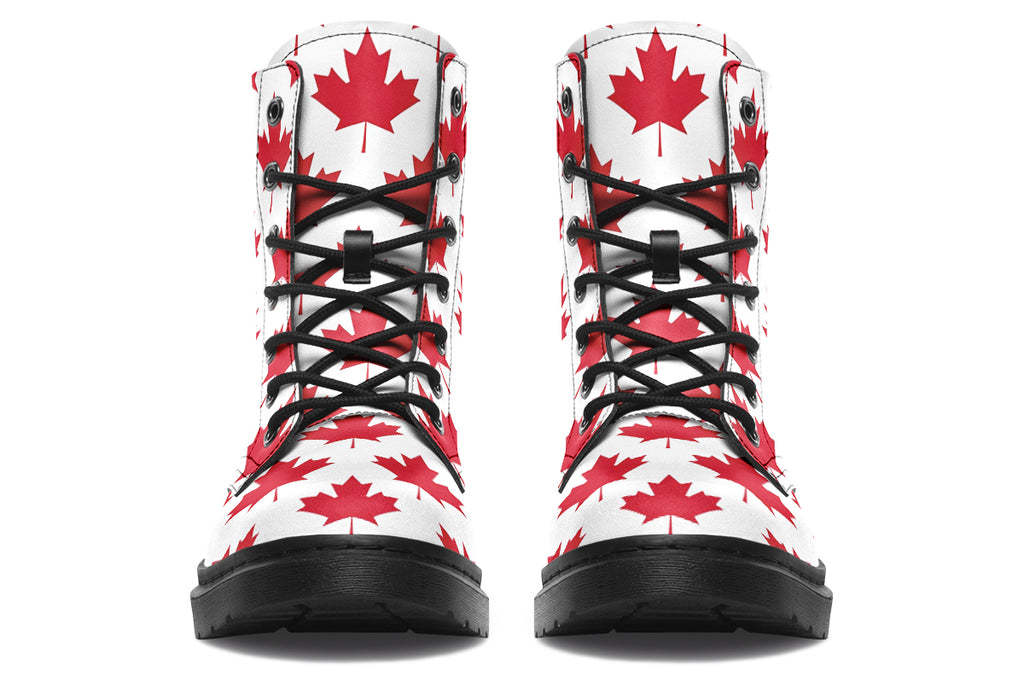 White boots with red maple leaf patterns all over it