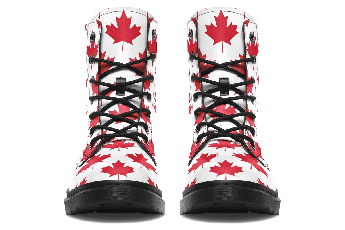 White boots with red maple leaf patterns all over it