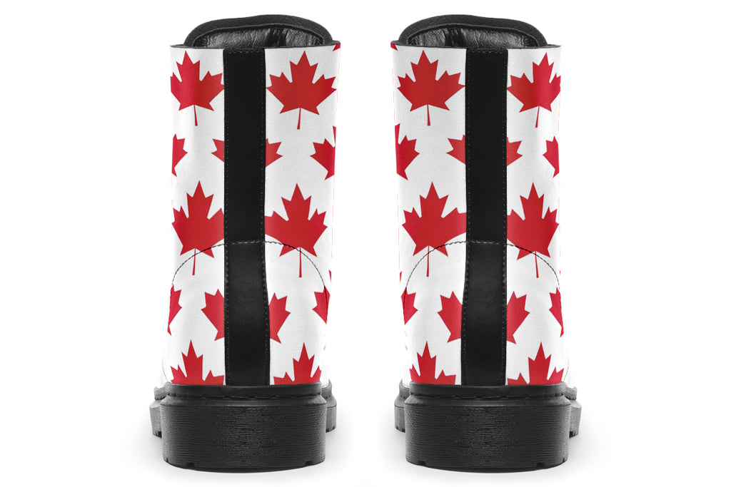 White boots with red maple leaf patterns all over it