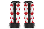White boots with red maple leaf patterns all over it
