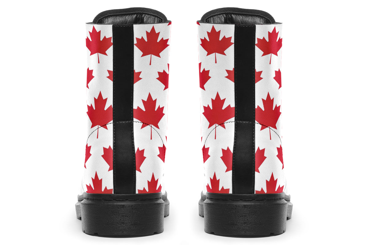 White boots with red maple leaf patterns all over it