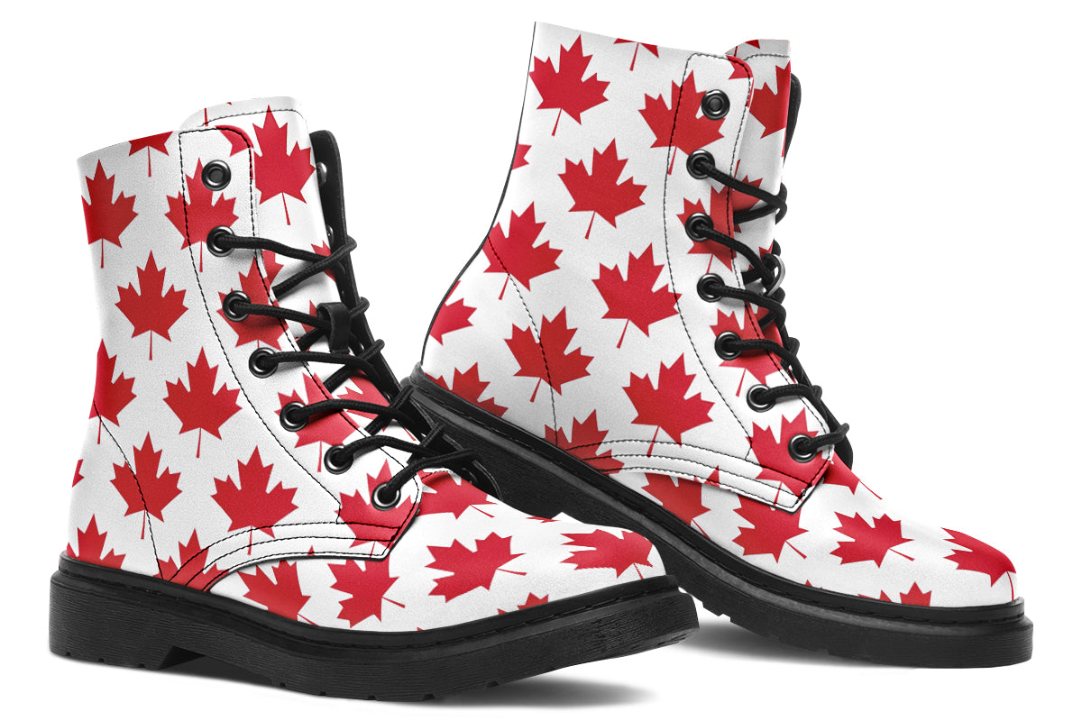 White boots with red maple leaf patterns all over it