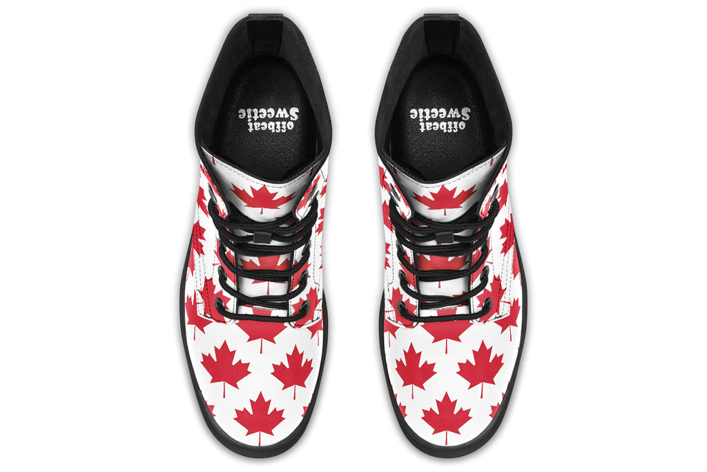 White boots with red maple leaf patterns all over it