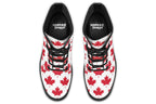 White boots with red maple leaf patterns all over it