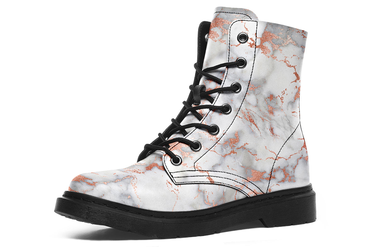 Boots featuring a grey marble-like pattern with accents of blush pink throughout the marble design