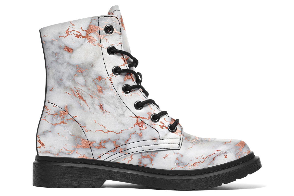 Boots featuring a grey marble-like pattern with accents of blush pink throughout the marble design