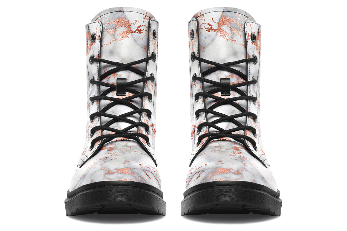 Boots featuring a grey marble-like pattern with accents of blush pink throughout the marble design