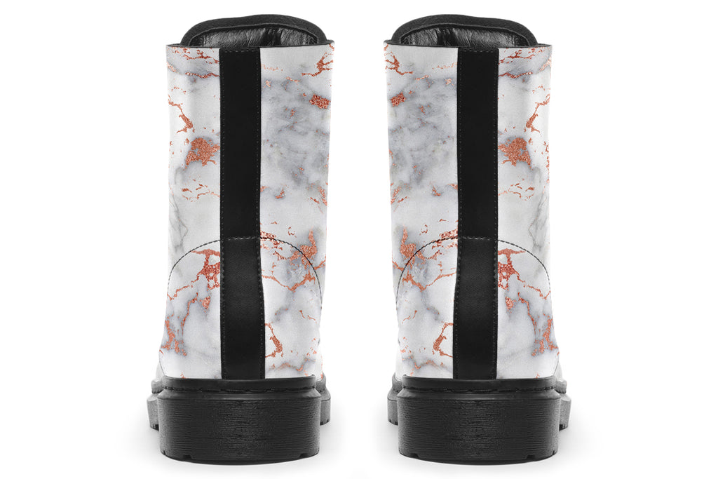 Boots featuring a grey marble-like pattern with accents of blush pink throughout the marble design