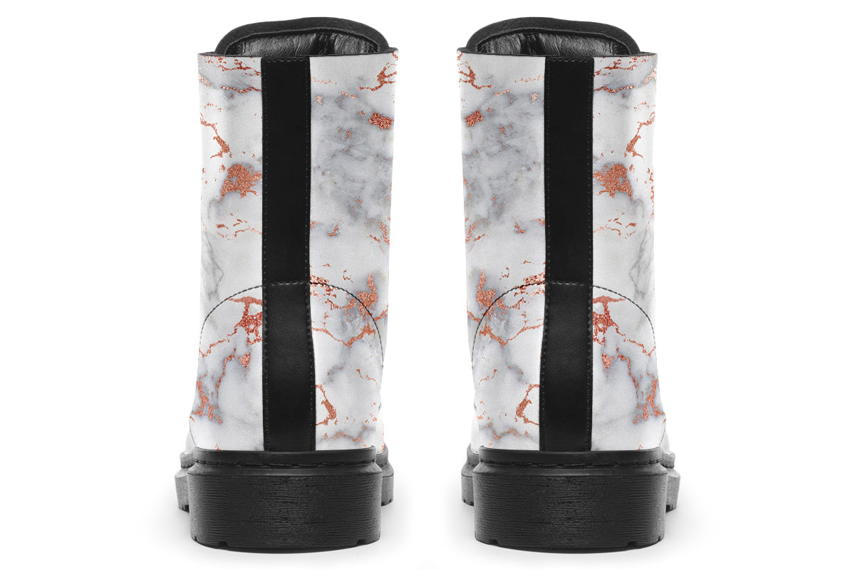 Boots featuring a grey marble-like pattern with accents of blush pink throughout the marble design