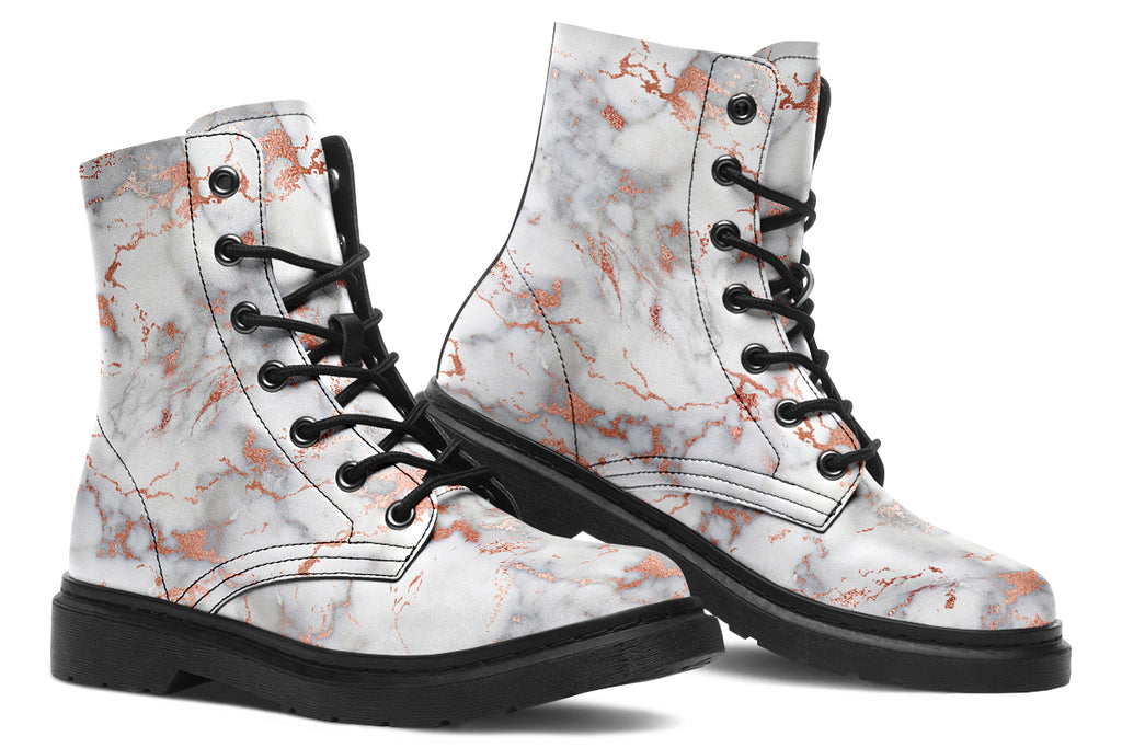 Boots featuring a grey marble-like pattern with accents of blush pink throughout the marble design