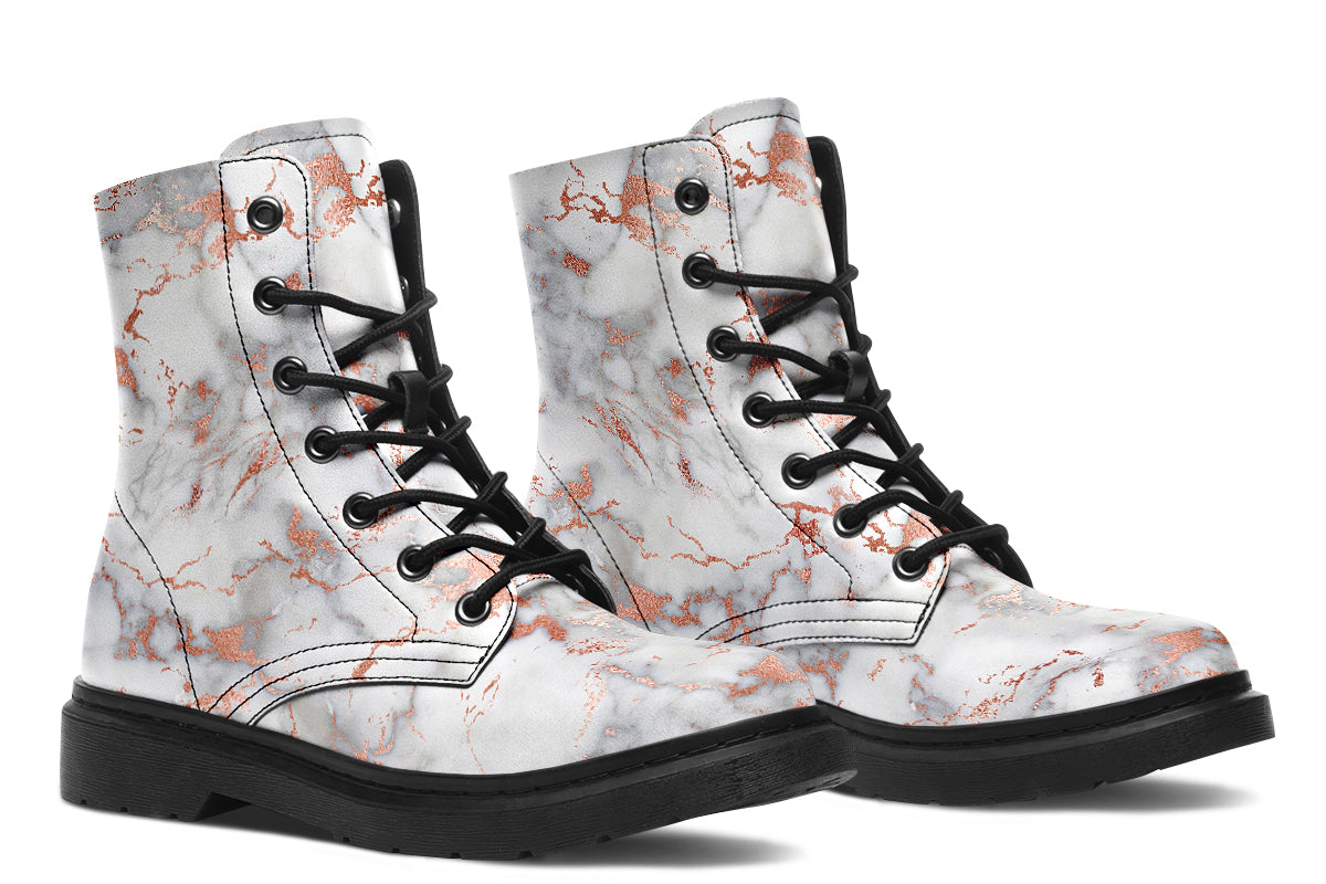 Boots featuring a grey marble-like pattern with accents of blush pink throughout the marble design