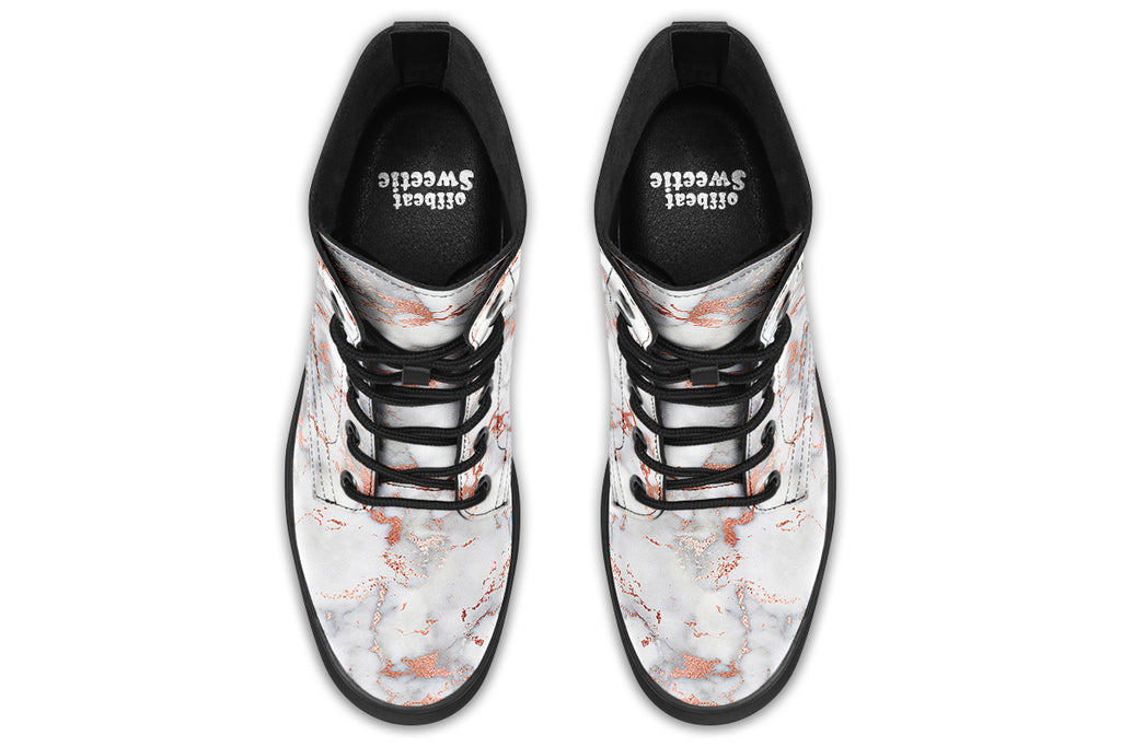 Boots featuring a grey marble-like pattern with accents of blush pink throughout the marble design