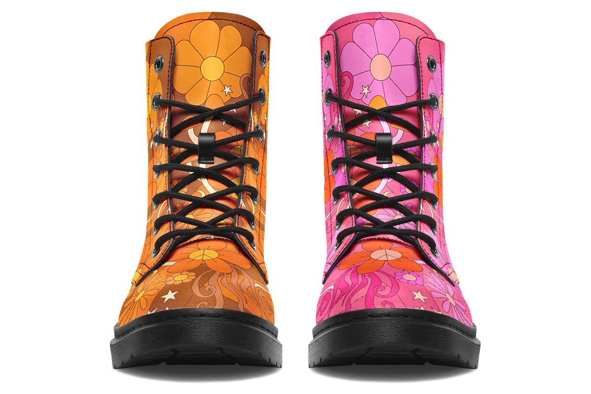 Mismatched boots featuring a retro floral design. One is pink and the other is orange.