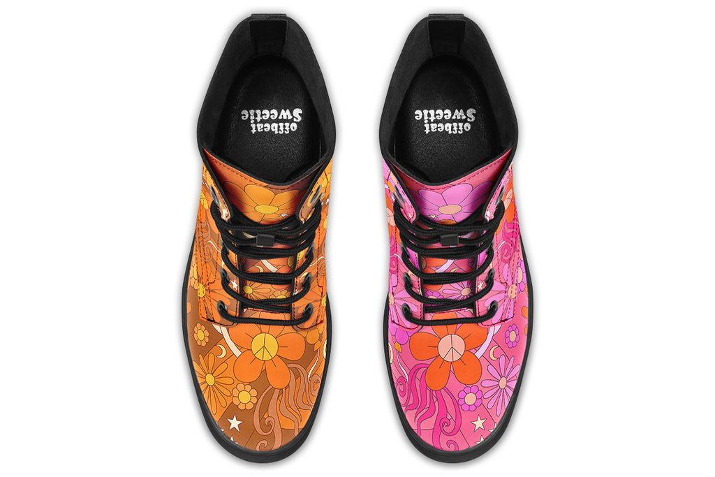 Mismatched boots featuring a retro floral design. One is pink and the other is orange.