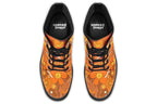 Orange boots featuring a retro floral design