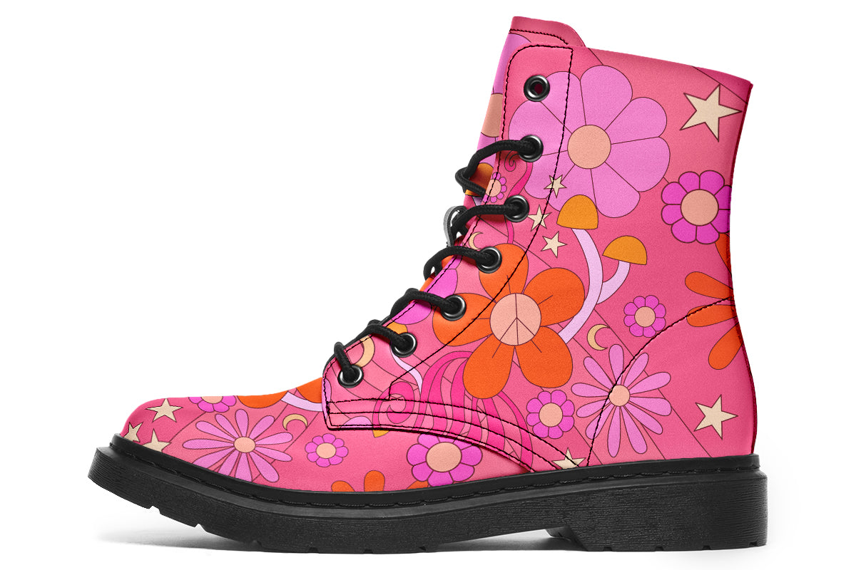 Pink boots with a black sole. Pattern shows midcentury retro-style daisies and decorative swirls.