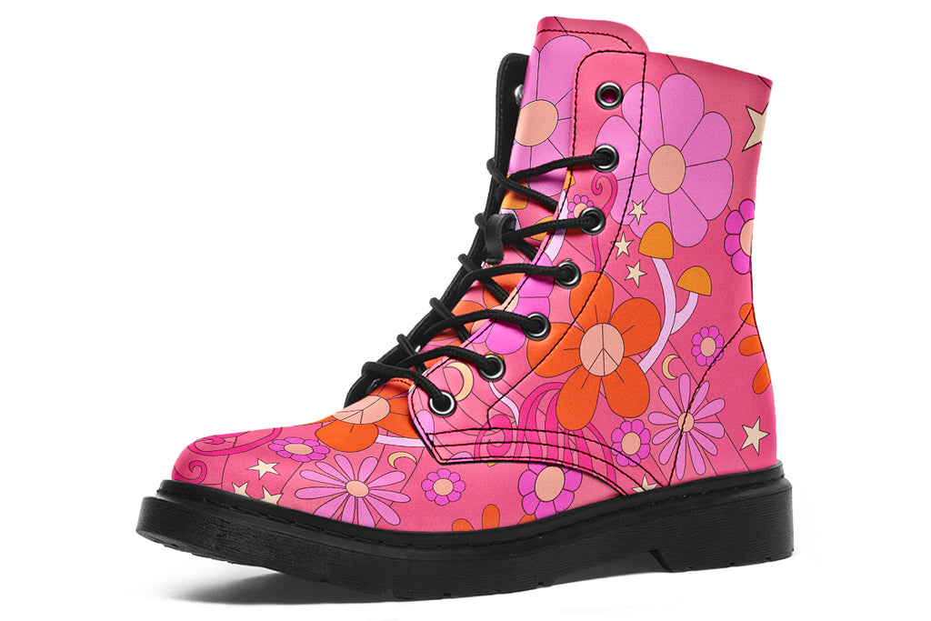 Pink boots with a black sole. Pattern shows midcentury retro-style daisies and decorative swirls.