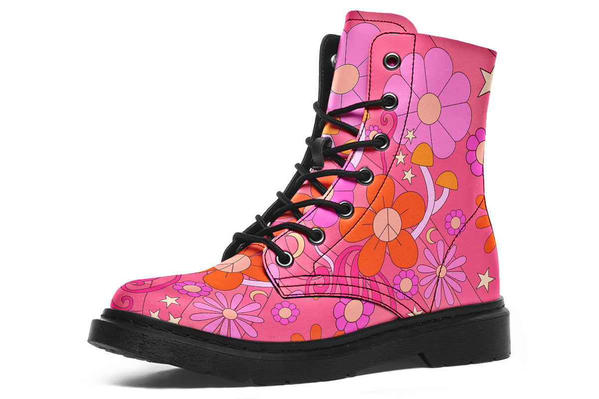 Pink boots with a black sole. Pattern shows midcentury retro-style daisies and decorative swirls.