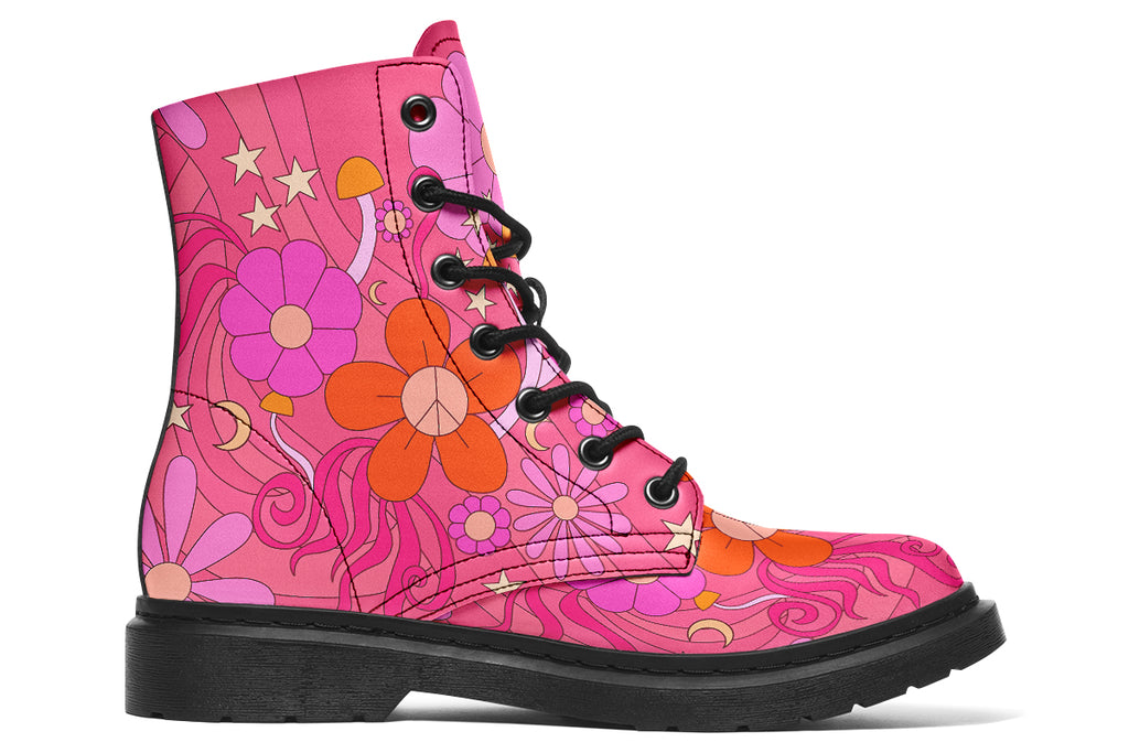 Pink boots with a black sole. Pattern shows midcentury retro-style daisies and decorative swirls.