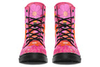 Pink boots with a black sole. Pattern shows midcentury retro-style daisies and decorative swirls.
