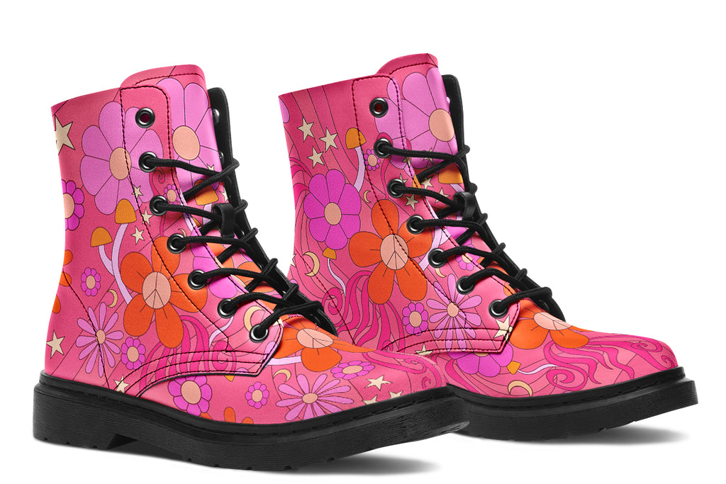 Pink boots with a black sole. Pattern shows midcentury retro-style daisies and decorative swirls.