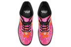 Pink boots with a black sole. Pattern shows midcentury retro-style daisies and decorative swirls.