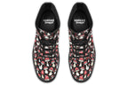 Black boots with a pattern of red and white mushrooms all over them